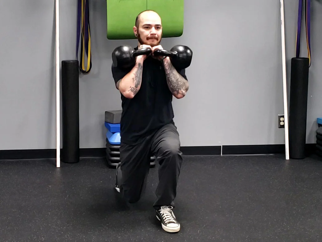 Double Kettlebell lunge