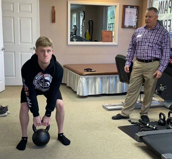 Paul Britt instructing kettlebell deadlift and deadlift drag