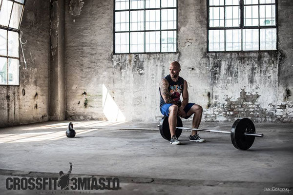 Maciej with kettlebell and barbell