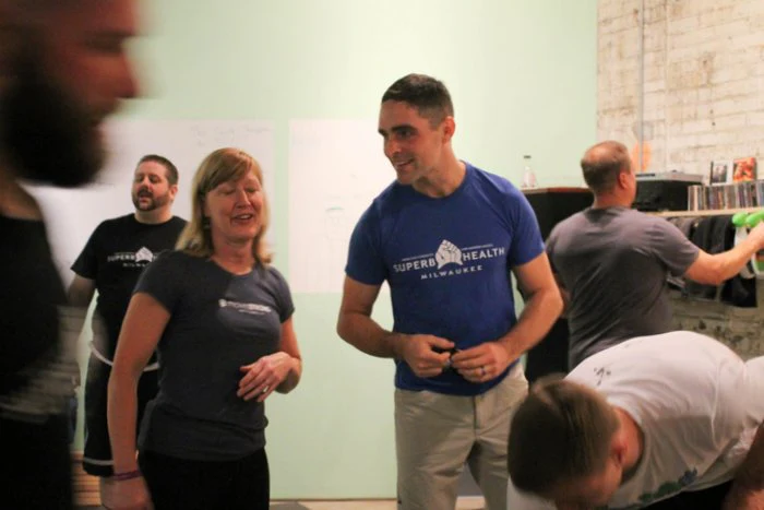 Team Leader Lori Crock and TL Nick Lynch working together teaching a class in Milwaukee.